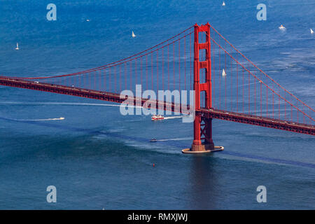 Aerial view of the South tower of Golden Gate Bridge and yachts on the bay, flying over San Francisco, USA Stock Photo