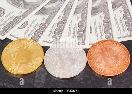 Bitcoins as symbol of electronic virtual money and dollar, choice between traditional paper money and cryptocurrency Stock Photo