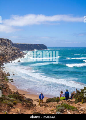 Trekkers enjoying a view of the coastline towards Cape St. Vincent, Portugal's most south westerly point, in the Algarve region. The area is part of t Stock Photo