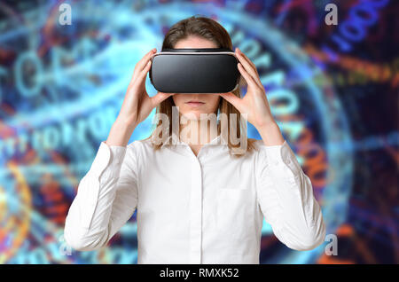 Young woman in white t-shirt touching 3D goggles on her head. Using virtual reality concept against glowing abstract digital background. Front half-le Stock Photo