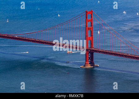 Aerial view of the South tower of Golden Gate Bridge and yachts on the bay, flying over San Francisco, USA Stock Photo