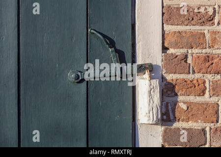 abstract rusty brass brown knocker in a door curch closed wood - image Stock Photo