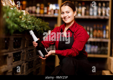 Picture of happy woman with bottle of wine Stock Photo