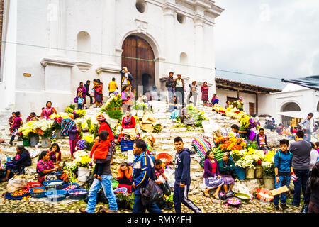 Chichicastenango, Guatemala on 2th May 2016: View on group of indigenous people selling products in front of church Stock Photo
