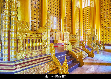 BAGO, MYANMAR - FEBRUARY 15, 2018: The Lion (Thihathana) Throne Hall of Kanbawzathadi Golden palace is decorated with intricate carved patterns, mirro