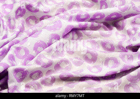 Cloth cotton, cambric in lilac polka dots on white Stock Photo