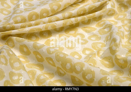 Cloth cotton, cambric in yellow polka dots on white Stock Photo