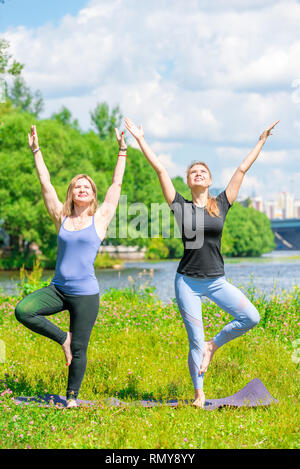 Premium Photo  Beautiful female trainer is engaged in pilates workout and  hatha yoga on the background of a yellow wall yoga classes web banner
