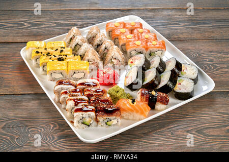 https://l450v.alamy.com/450v/rmya34/philadelphia-rolls-triangle-uramaki-california-rolls-sake-nigiri-unagi-nigiri-and-cheese-rolls-decorated-with-mayo-wasabi-and-pickled-ginger-traditional-japanese-sushi-set-in-restaurant-rmya34.jpg