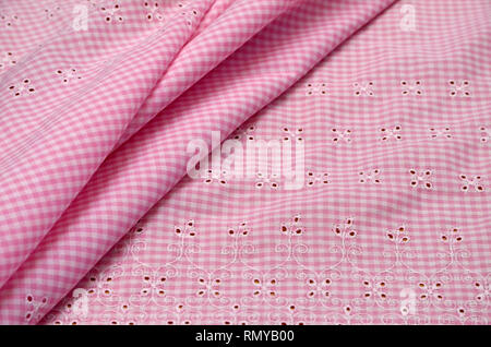 Cotton fabric, sewing on a white and pink cage Stock Photo
