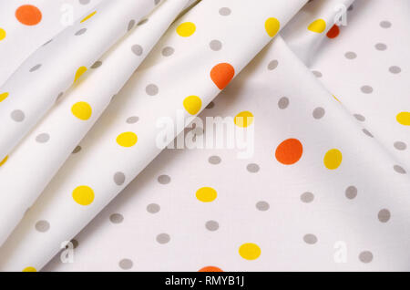 Cotton stretch fabric with colored polka dots on white Stock Photo