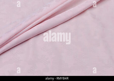 Cotton fabric pink color with pink ornaments, for shirts Stock Photo