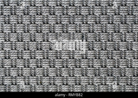 Texture of a symmetrical gray carpet. Lovely abstract texture to be used as a background, wallpaper, etc. Semicloseup image taken with macro lens. Stock Photo