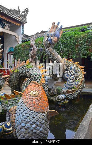 A pond depicting dragons in the grounds of the Cantonese Assembly Hall, also known as Quang Trieu, built by Cantonese merchants in 1885 in the histori Stock Photo