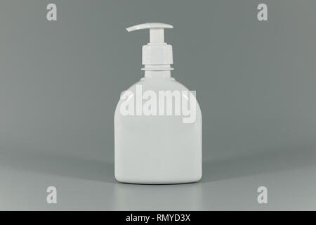 white blank perfume dispenser bottle on gray background Stock Photo
