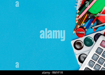 School supplies on blue background ready for your design Stock Photo