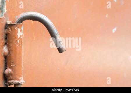 Orange painted steel with a hook lock Stock Photo