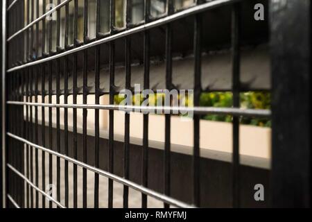Black painted gate perspective pattern Stock Photo