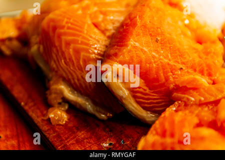 Salmon cuts on a cutting board isolated rustic Stock Photo