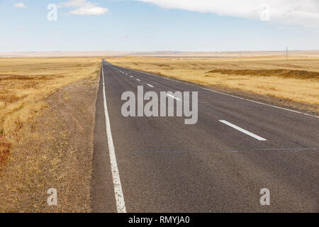 asphalt road in the mongolian steppe, Mongolia, Gobi Desert Stock Photo