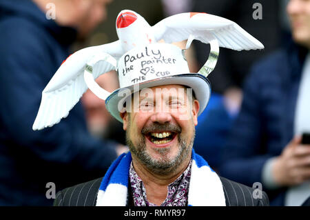 A general view of a Brighton and Hove Albion fan in the stands wearing a seagull hat during the FA Cup fifth round match at the AMEX Stadium, Brighton. Stock Photo