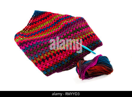 crocheted with crochet hook handmade , isolated on white background in red,green,pink,purple and blue Stock Photo