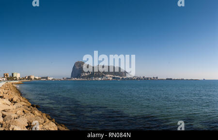 Panoramic view of top of Gibraltar Rock (uUnited Kingdom), in Upper Rock Natural Reserve: on the left Gibraltar town and bay, La Linea town in Spain a Stock Photo