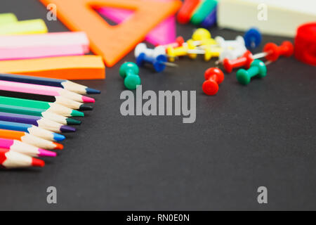 school office supplies on a chalkboard background Stock Photo