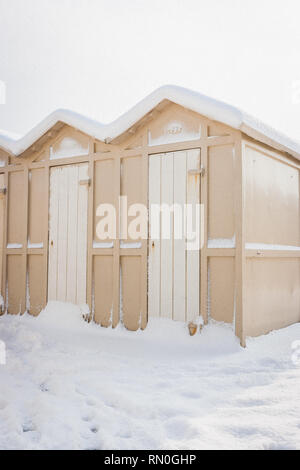 View of some "Cabine" (Beach huts) covered in snow in Riccione, Emilia Romagna, Italy. Stock Photo