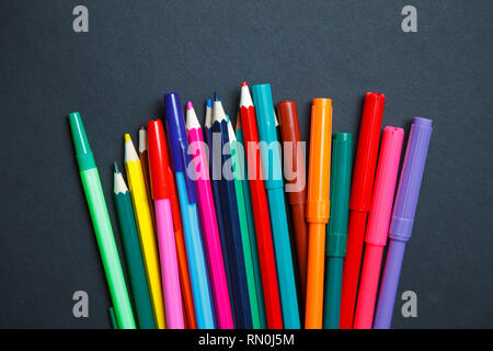 Color pencils on dark background. Top view with copy space Stock Photo