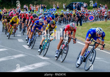 Tour de France 2018 - stage 8. The peloton passing through Marseille en Beauvaisis, France about 60 kilometres from the finish in Amiens Stock Photo