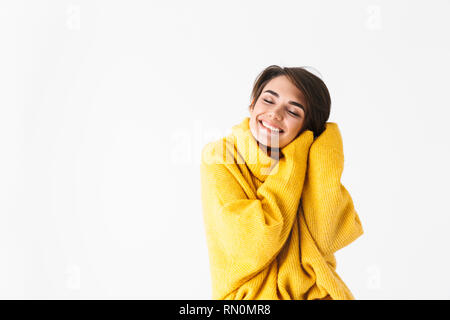 Happy cheerful girl wearing hoodie standing isolated over white background, posing Stock Photo