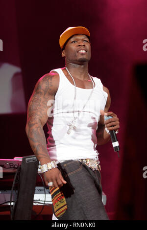 Rapper, Curtis James Jackson III, better known by his stage name 50 Cent, is shown on stage during a live concert performance. Stock Photo