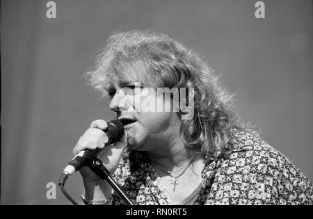 Vocalist Lou Gramm is shown performing on stage during a 'live' concert appearance with Foreigner. Stock Photo