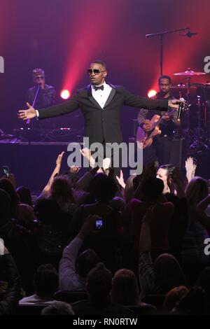 Actor, stand-up comedian, singer-songwriter, musician and talk radio host Eric Bishop, better known by his stage name Jamie Foxx, is shown performing on stage during a 'live' concert appearance. Stock Photo