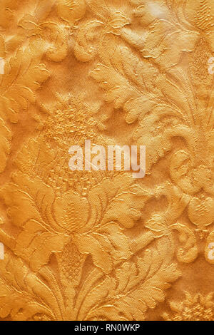 Seamless pattern. Golden textured curls. Brilliant lace, stylized flowers. Openwork weaving delicate, golden background, Paisley Stock Photo