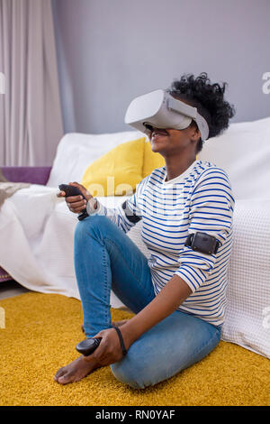 Free Photo  African american man playing multiplayer online action rpg on  pc while girlfriend is fighting in virtual reality game in living room.  gamer streaming first person shooter while woman uses