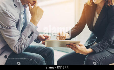 businessman investment consultant analyzing company financial report balance sheet statement working with digital graphs. Stock Photo