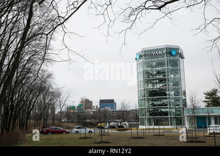 A logo sign outside of a Carvana car vending machine in Gaithersburg, Maryland on February 10, 2019. Stock Photo