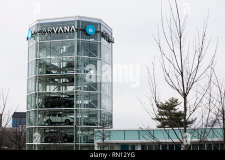 A logo sign outside of a Carvana car vending machine in Gaithersburg, Maryland on February 10, 2019. Stock Photo