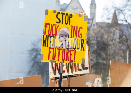 LONDON, UK - February 15, 2019: Protestors with banners at a Youth strike for climate march in central London Stock Photo