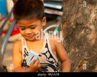 Portrait of a cute, happy,smiling, young, local,   primary school age Cambodian child  Kampong Tralach, Oudong, Cambodia, Asia Stock Photo