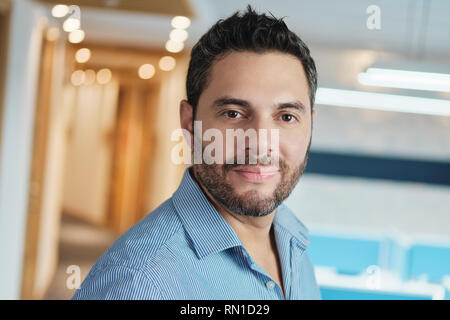 Portrait Of Happy Young Manager Business Man Smiling At Work Stock Photo