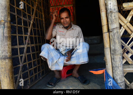 Rohingya refugee people pose for a picture in front his house in the Balukhali refugee camp in Ukhia, Cox's Bazar, Bangladesh. On February 02, 2019 Stock Photo