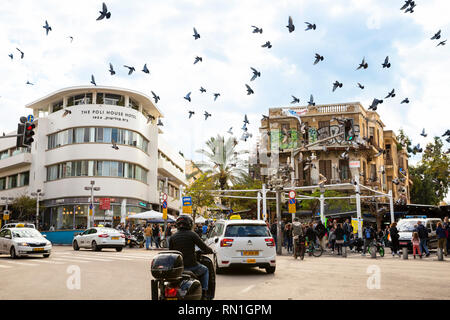 Tel Aviv-Yafo, Carmel market, Israel - December 28, 2018: Busy Magen David square - view of crowded entrance and flying pigeon birds at the  Carmel Stock Photo