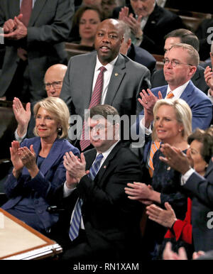 Washington DC, USA. 5th February 2019. The audience applauds as United States President Donald J. Trump delivers his second annual State of the Union Address to a joint session of the US Congress in the US Capitol in Washington, DC on Tuesday, February 5, 2019. Pictured top row, from left to right: US Senator Pat Roberts (Republican of Kansas), US Senator Tim Scott (Republican of South Carolina), and Acting White House Chief of Staff and Director of the Office of Management and Budget (OMB) Mick Mulvaney. Pictured lower row, from left to right: US Secretary of Education Betsy DeVos, US Secret  Stock Photo