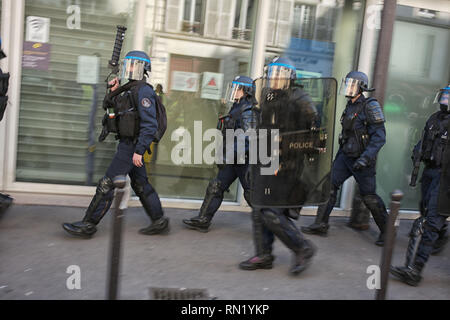 Paris, France. 16th February 2019. Demonstrators are protesting against police violences. Police officers are moving into the demonstration. Stock Photo