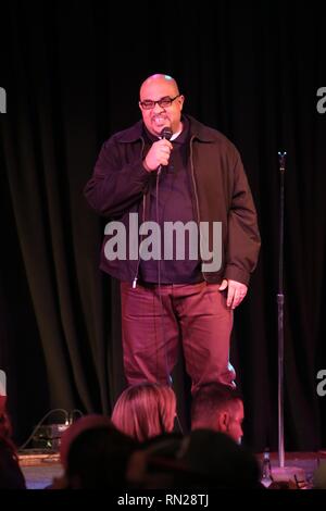 Comedian Freez Luv, aka Paul Farmer, is shown performing on stage during a 'live' concert appearance. Stock Photo