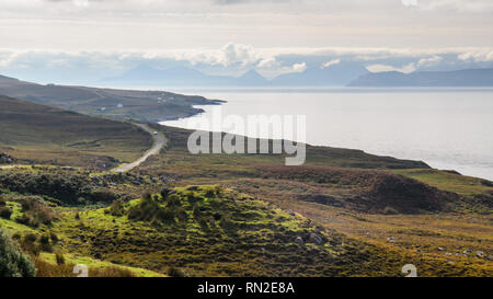 Applecross, Scotland, UK - September 24, 2013: A single car winds along the narrow cliff-top roads of the North Coast 500 route on the Applecross Peni Stock Photo