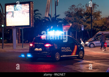 Valencia,Spain - February 16, 2019: A Spanish National Police Car patrolling Valencia city during night.  Night patrol. Stock Photo